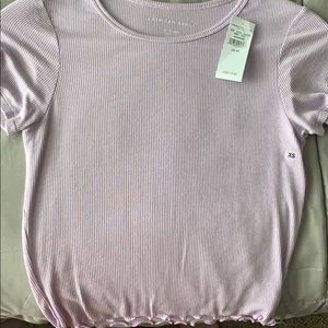 Purple T-shirt with ruffles at the bottom